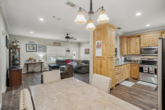 kitchen with dark wood-type flooring, ornamental molding, stainless steel appliances, and light brown cabinetry