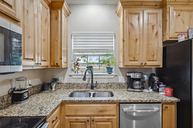 kitchen featuring sink, ornamental molding, stainless steel appliances, and light stone countertops