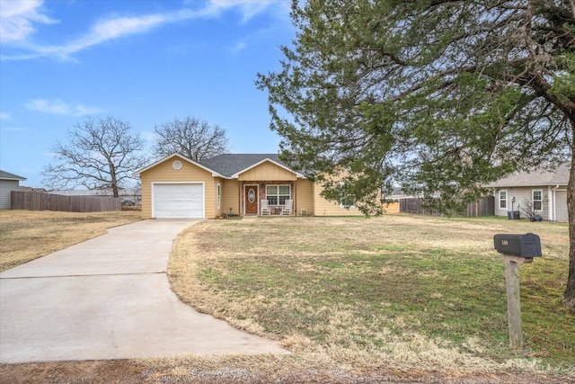 ranch-style home with a garage and a front yard