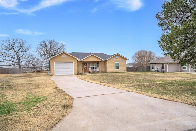 single story home featuring a garage and a front yard