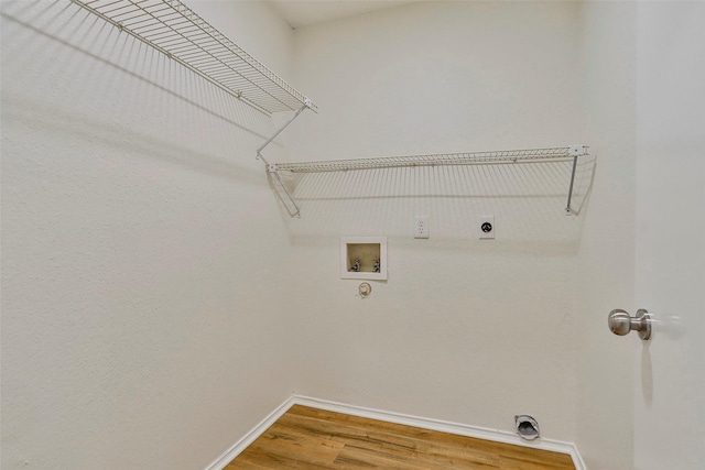 washroom featuring washer hookup, hookup for a gas dryer, hardwood / wood-style flooring, and hookup for an electric dryer