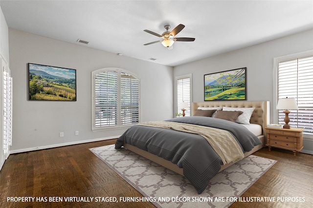 bedroom featuring dark wood-type flooring and ceiling fan