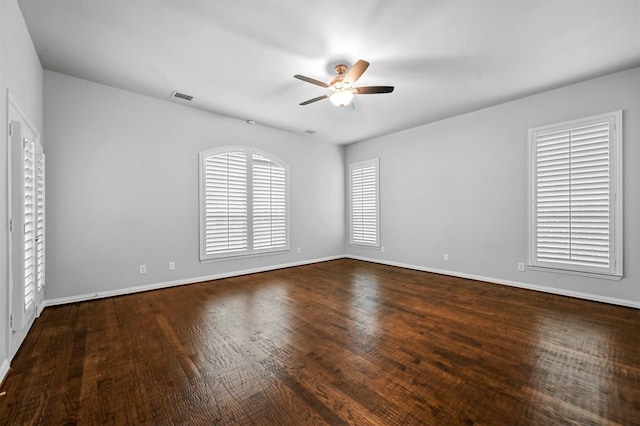 empty room featuring wood-type flooring and ceiling fan