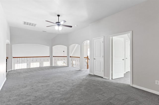 unfurnished room with carpet, lofted ceiling, and ceiling fan