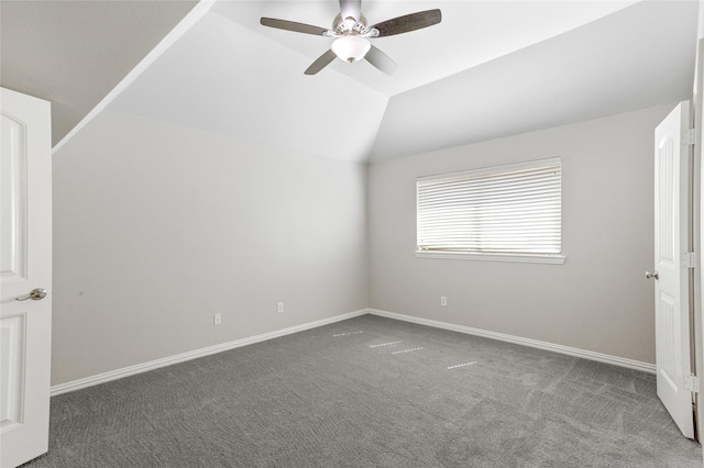 interior space featuring vaulted ceiling, carpet floors, and ceiling fan