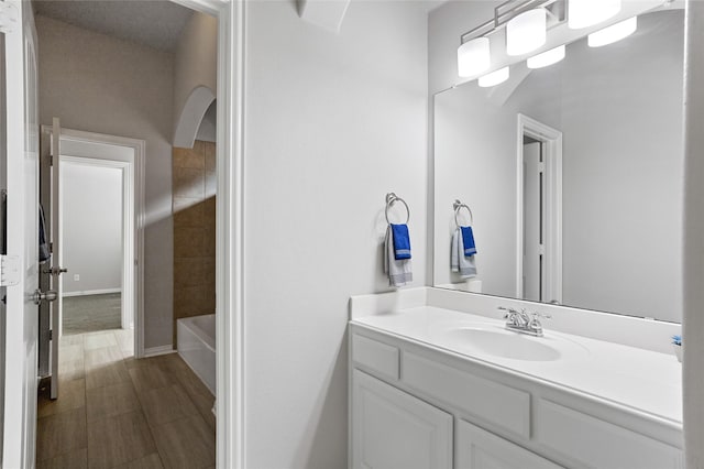 bathroom featuring vanity and tiled shower / bath combo