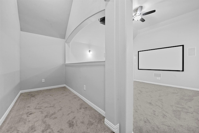 interior space with light carpet and ceiling fan