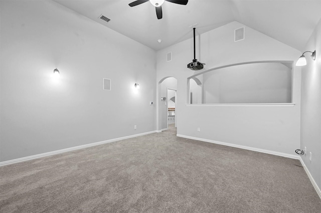 carpeted spare room with lofted ceiling and ceiling fan