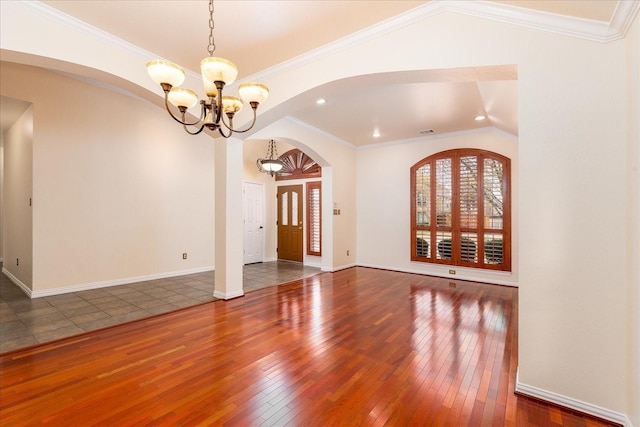3108 Fernhurst Dr, Richardson, TX 75082 - spare room featuring recessed lighting, vaulted ceiling, arched walkways, a chandelier, and hardwood / wood-style flooring