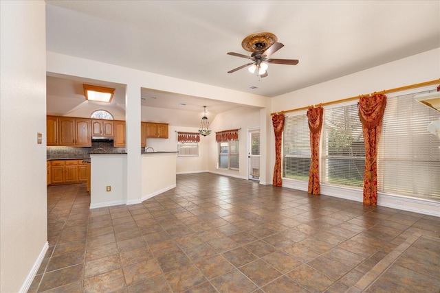3108 Fernhurst Dr, Richardson, TX 75082 - unfurnished living room with baseboards and ceiling fan