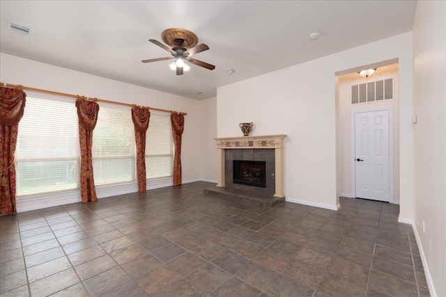 3108 Fernhurst Dr, Richardson, TX 75082 - unfurnished living room with a tiled fireplace, a ceiling fan, visible vents, and baseboards