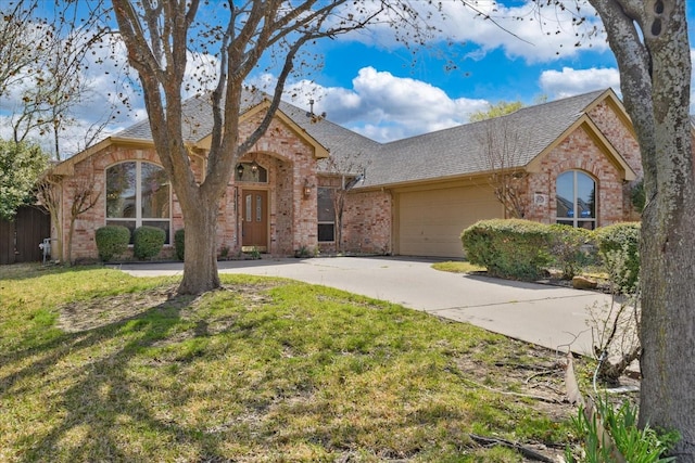 3108 Fernhurst Dr, Richardson, TX 75082 - view of front of property with brick siding, a garage, a front lawn, and concrete driveway