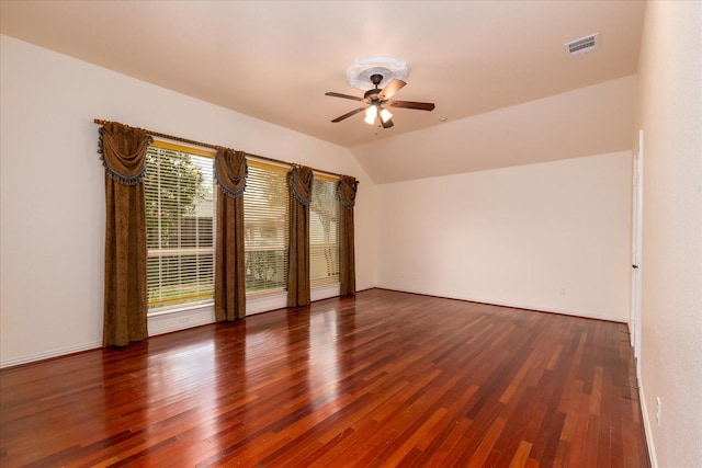 3108 Fernhurst Dr, Richardson, TX 75082 - empty room featuring vaulted ceiling, a ceiling fan, wood finished floors, and visible vents