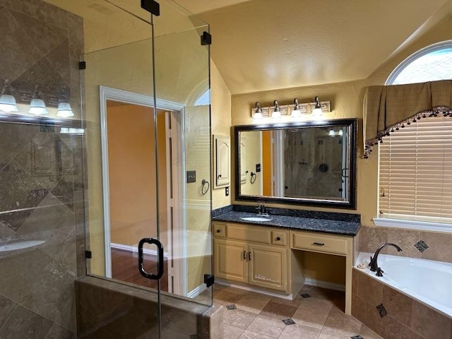 bathroom with lofted ceiling, vanity, plus walk in shower, and tile patterned floors