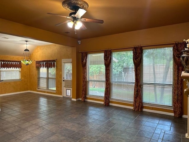 interior space with ceiling fan