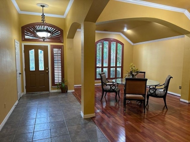 entryway with dark hardwood / wood-style flooring and crown molding