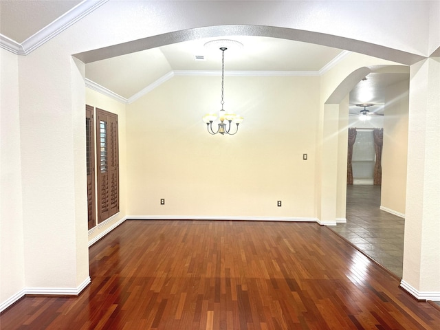 unfurnished dining area featuring ornamental molding, baseboards, lofted ceiling, and wood finished floors