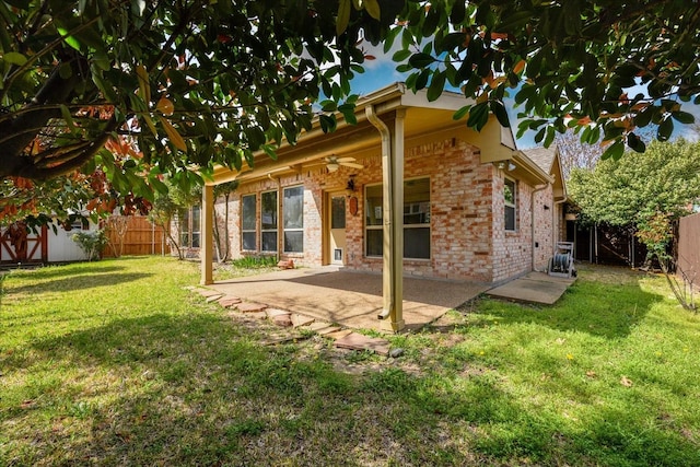 3108 Fernhurst Dr, Richardson, TX 75082 - rear view of property featuring a fenced backyard, a ceiling fan, a yard, and a patio