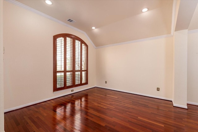 3108 Fernhurst Dr, Richardson, TX 75082 - spare room featuring vaulted ceiling, ornamental molding, wood finished floors, and visible vents