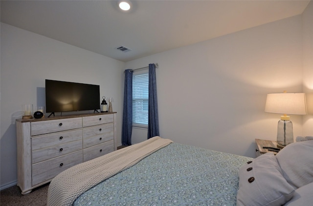 bedroom with dark carpet