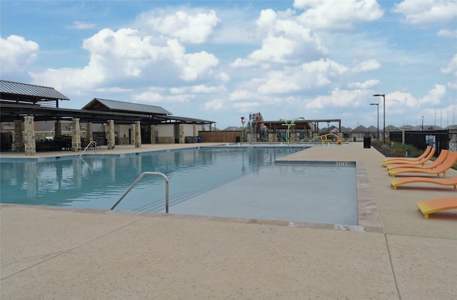 view of swimming pool with a patio