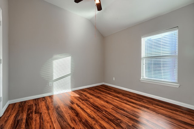 unfurnished room featuring lofted ceiling, dark wood-type flooring, and ceiling fan