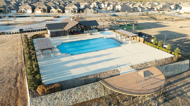 view of swimming pool featuring an outbuilding and a patio area