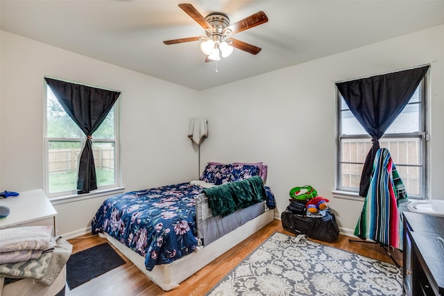 bedroom featuring hardwood / wood-style flooring and ceiling fan