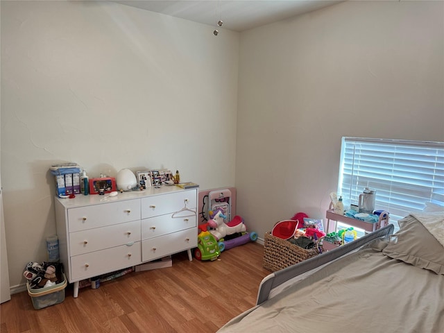 bedroom with light hardwood / wood-style flooring