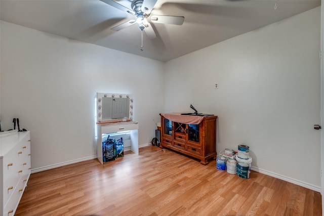 misc room with ceiling fan and light hardwood / wood-style flooring