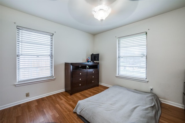 bedroom featuring wood-type flooring and ceiling fan