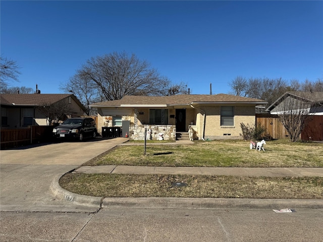 view of front of property with a carport and a front lawn