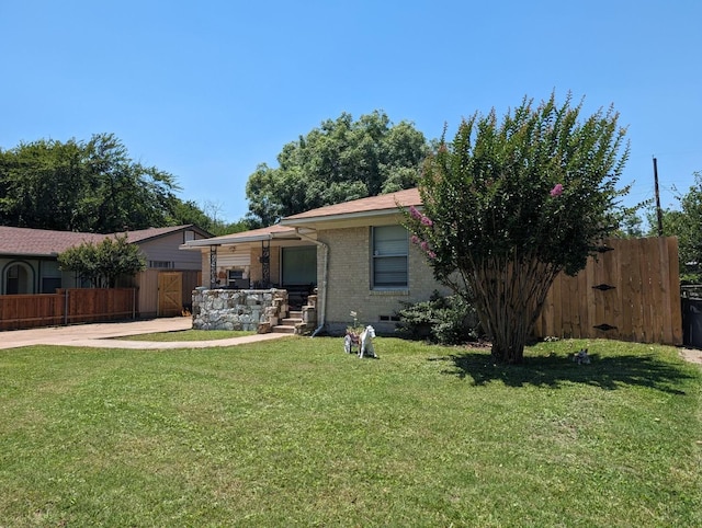 rear view of house with a yard