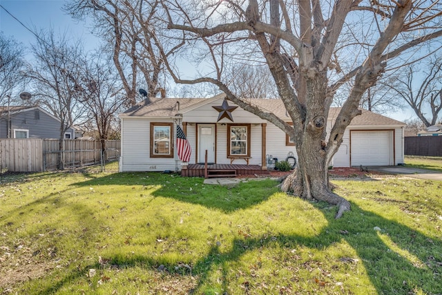 single story home featuring a garage and a front lawn