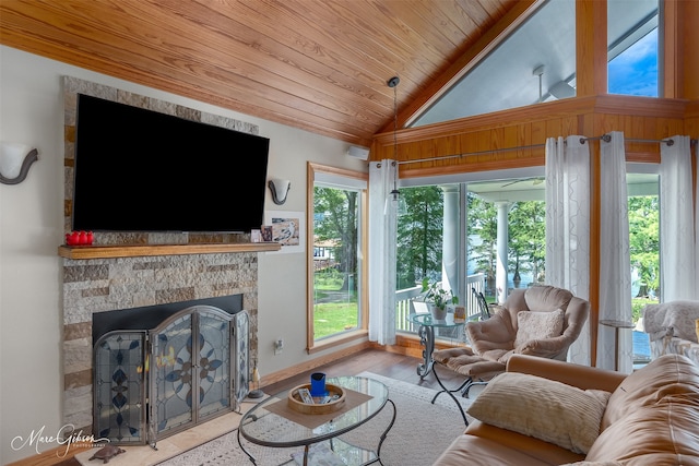 living room with lofted ceiling, wood ceiling, and light hardwood / wood-style flooring