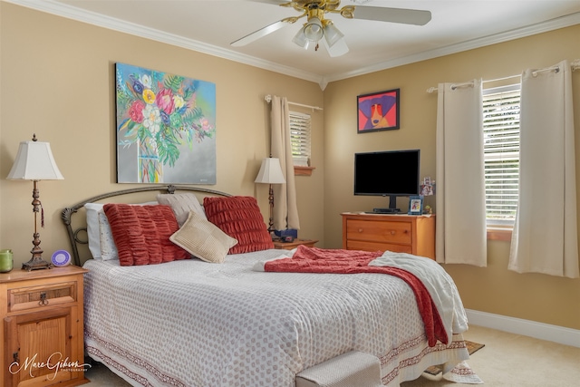 carpeted bedroom with crown molding and ceiling fan