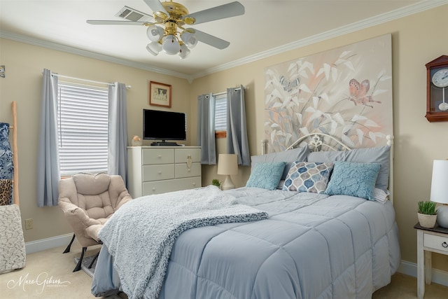 carpeted bedroom featuring ceiling fan, ornamental molding, and multiple windows