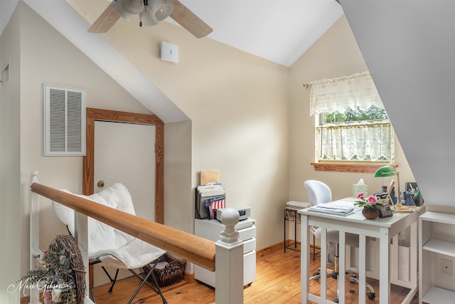 office with ceiling fan, lofted ceiling, and light hardwood / wood-style flooring