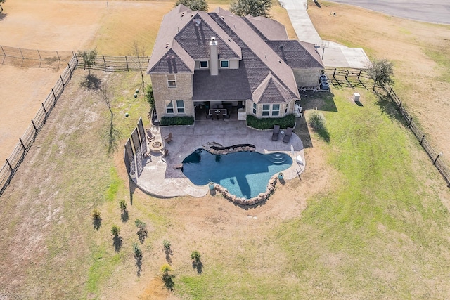 birds eye view of property with a rural view