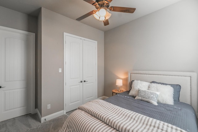 carpeted bedroom with baseboards, a closet, and ceiling fan