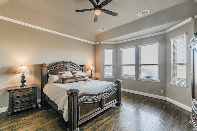 bedroom featuring wood finished floors, visible vents, and baseboards