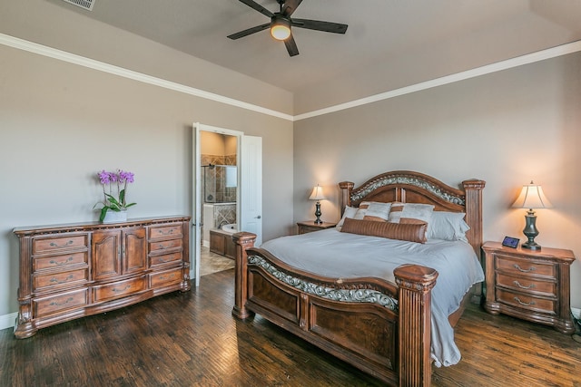 bedroom featuring a ceiling fan, baseboards, dark wood-style flooring, and ensuite bathroom