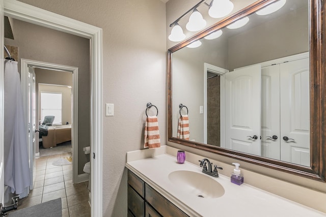 bathroom with vanity and tile patterned floors