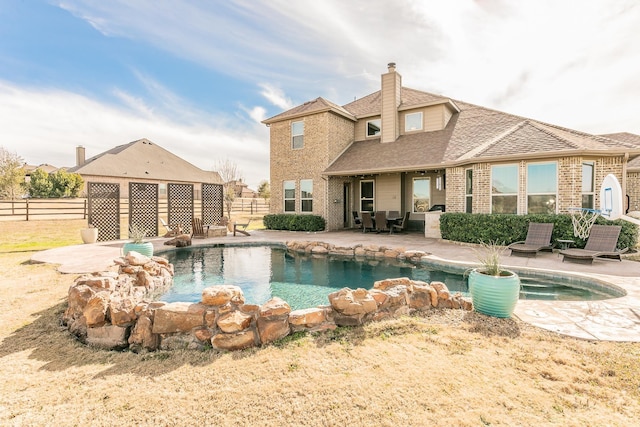 view of pool with a fenced in pool, a patio area, and fence