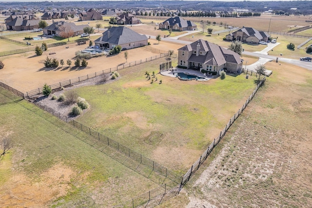 birds eye view of property with a rural view