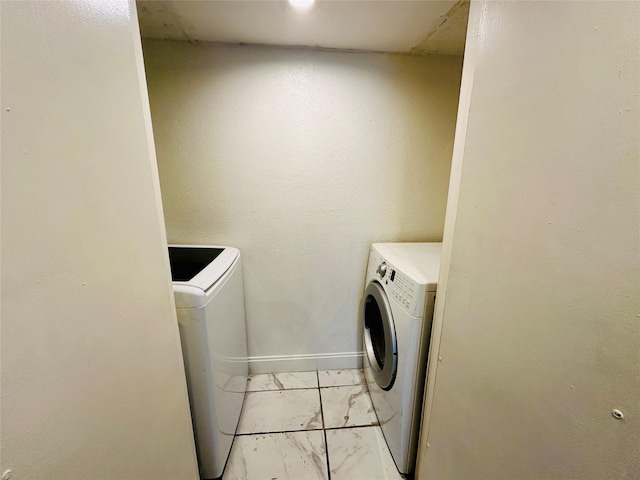 laundry room featuring washing machine and clothes dryer