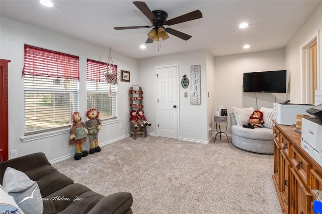 living room with light carpet and ceiling fan