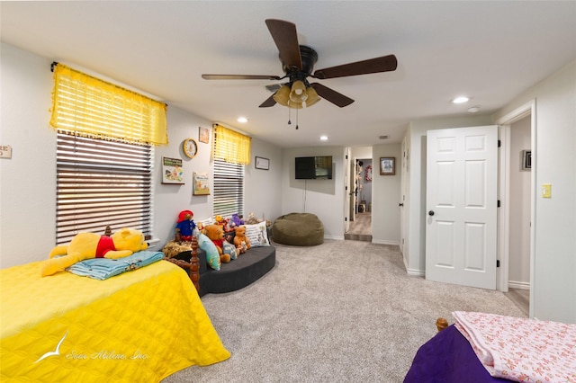 carpeted bedroom with ceiling fan