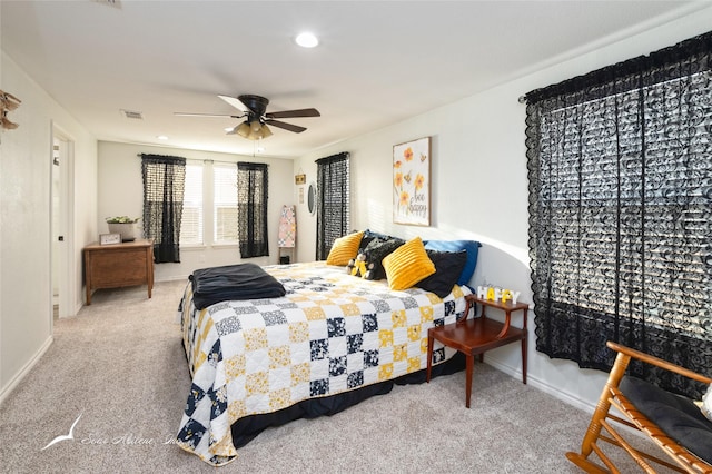 bedroom featuring light carpet and ceiling fan