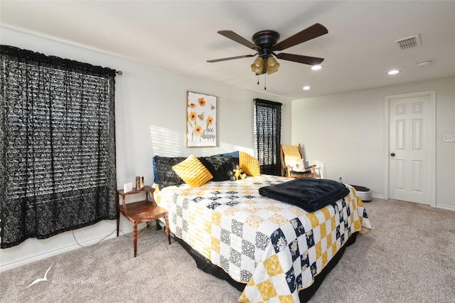 carpeted bedroom with ceiling fan